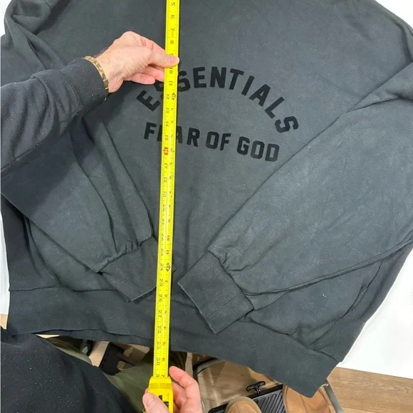 This is a Fear of God Essentials black sweatshirt. - Picture 3 of 7